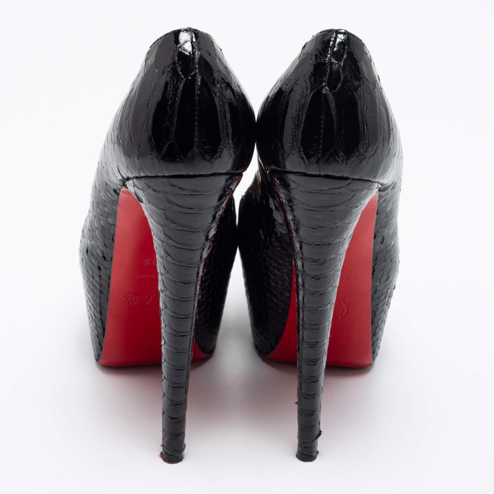 Louboutins are designed to lift one's attitude and outfit. So, let this pair lift yours as well by owning them today. Crafted from black python leather and lined with leather on the insoles, these pumps carry a Mary Jane style. Completed with
