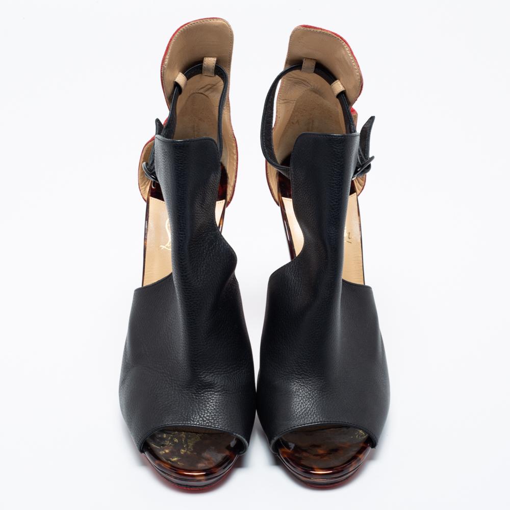 You'll love to wear these black and red ankle boots from Christian Louboutin as they are all about comfort and effortless style! These unique sandals are crafted from suede and leather and showcase cutout detailing. They are complete with smooth