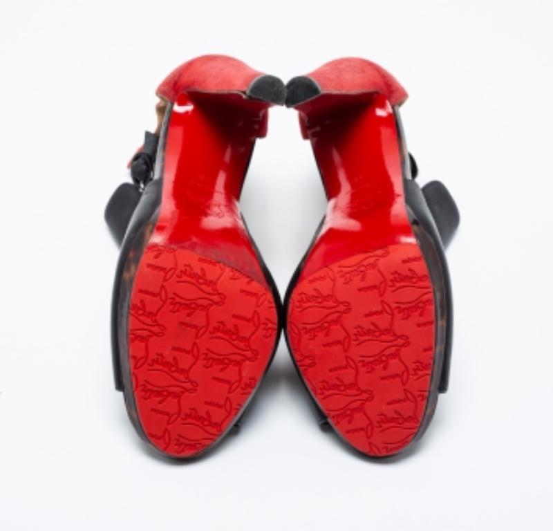 You'll love to wear these black and red ankle boots from Christian Louboutin as they are all about comfort and effortless style! These unique sandals are crafted from suede and leather and showcase cutout detailing. They are complete with smooth