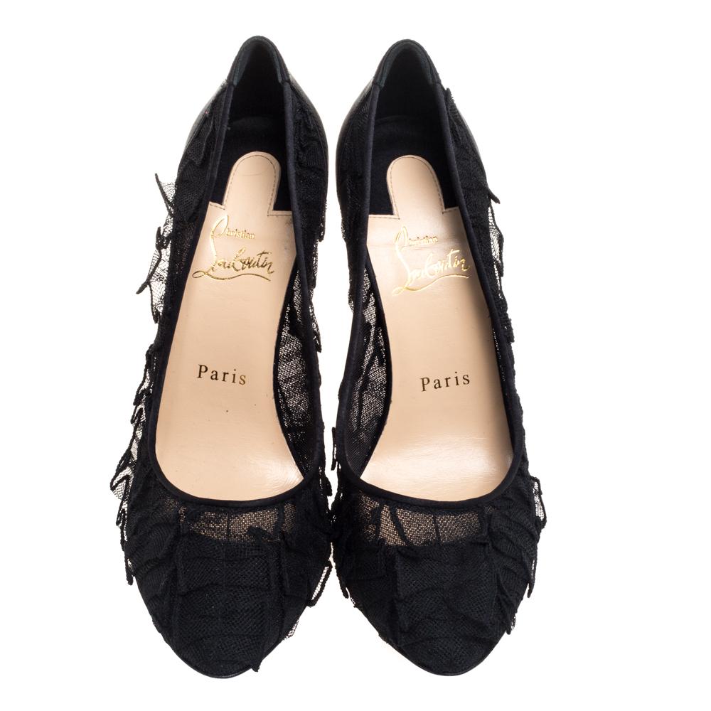 Perfect to flaunt, this pair of pumps by Christian Louboutin is stunning. The pumps have been crafted from lace and the exterior is in black. The pumps are styled with almond toes, satin counters, and are elevated on 10.5 cm heels. They offer