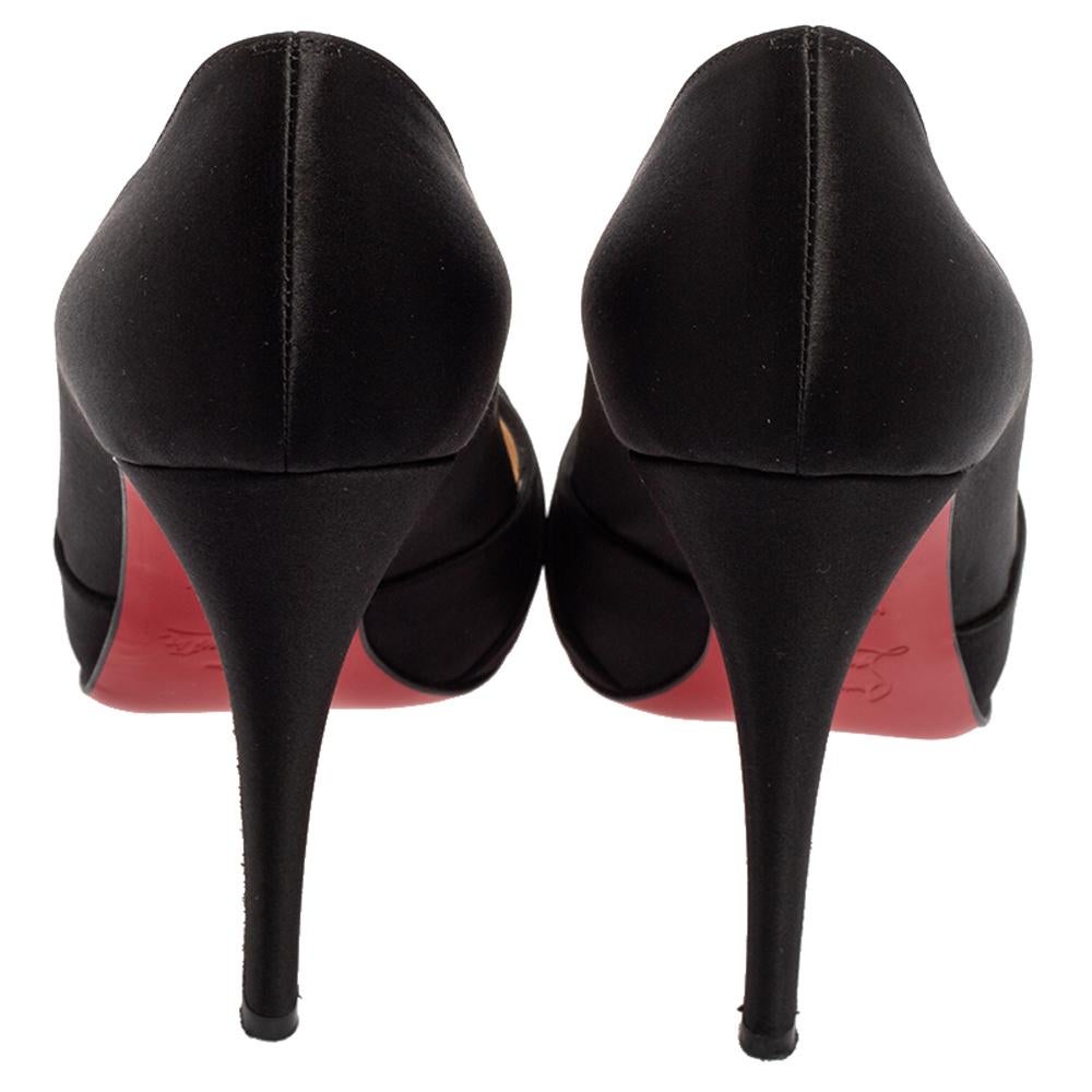Coming from the House of Christian Louboutin, these beautiful Matrinana pumps speak elegance and excellence. They are meticulously created using black satin and showcase peep-toes, a slip-on style, and 12 cm heels. For a signature touch, they are