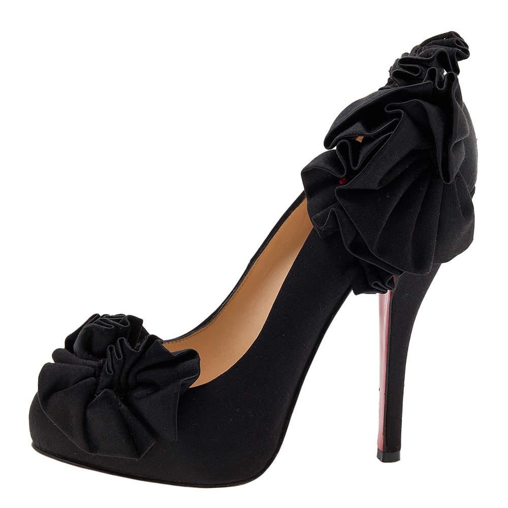 The chic design in black satin is given ruffle details, a covered toe, and a covered platform. For a classy effect, the CL pumps are finished with 12 cm heels and red soles.

Includes: Original Dustbag