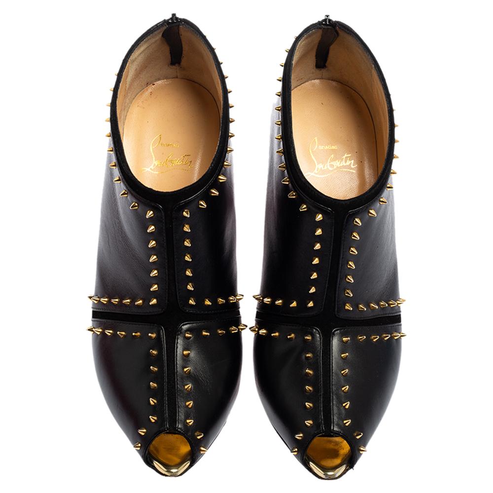 If you're someone who has a love for things that are edgy and unique, then these Louboutins are perfect for you. These booties are anything but dull. Luxuriously crafted from leather and detailed with suede, they feature peep toes, and gold-tone