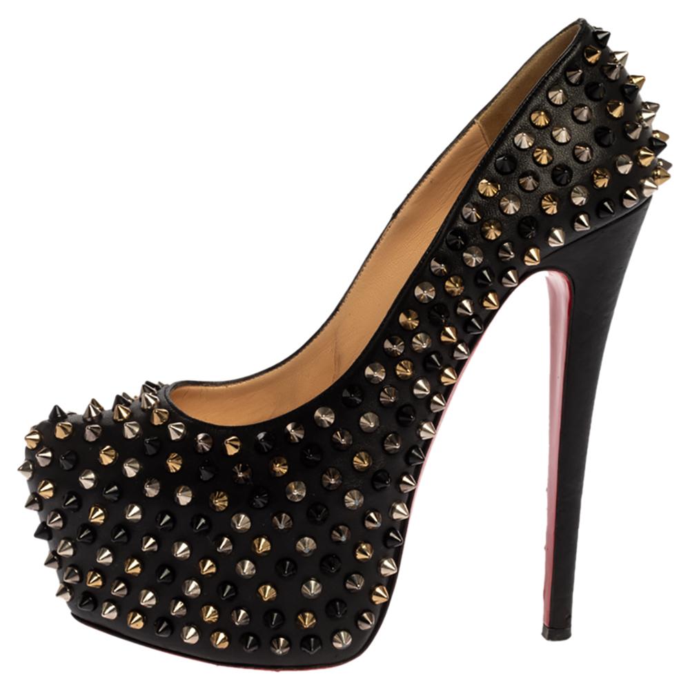 Take your love for Louboutins to new heights by adding this gorgeous pair to your collection. The pumps simply speak high fashion in every stitch and curve. The leather exterior comes covered in spikes and the pumps are finished with platforms, 15.5