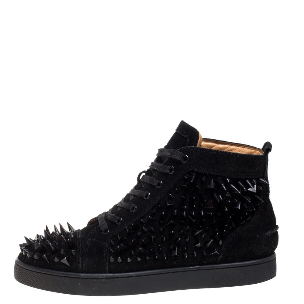 This pair of Pik Pik shoes presents a whole new spin to spiked boots. Its black, suede uppers are densely studded with spikes, giving it an edgy look. Black laces provide a tonal look and it is finished with the bold red Christian Louboutin outsole,