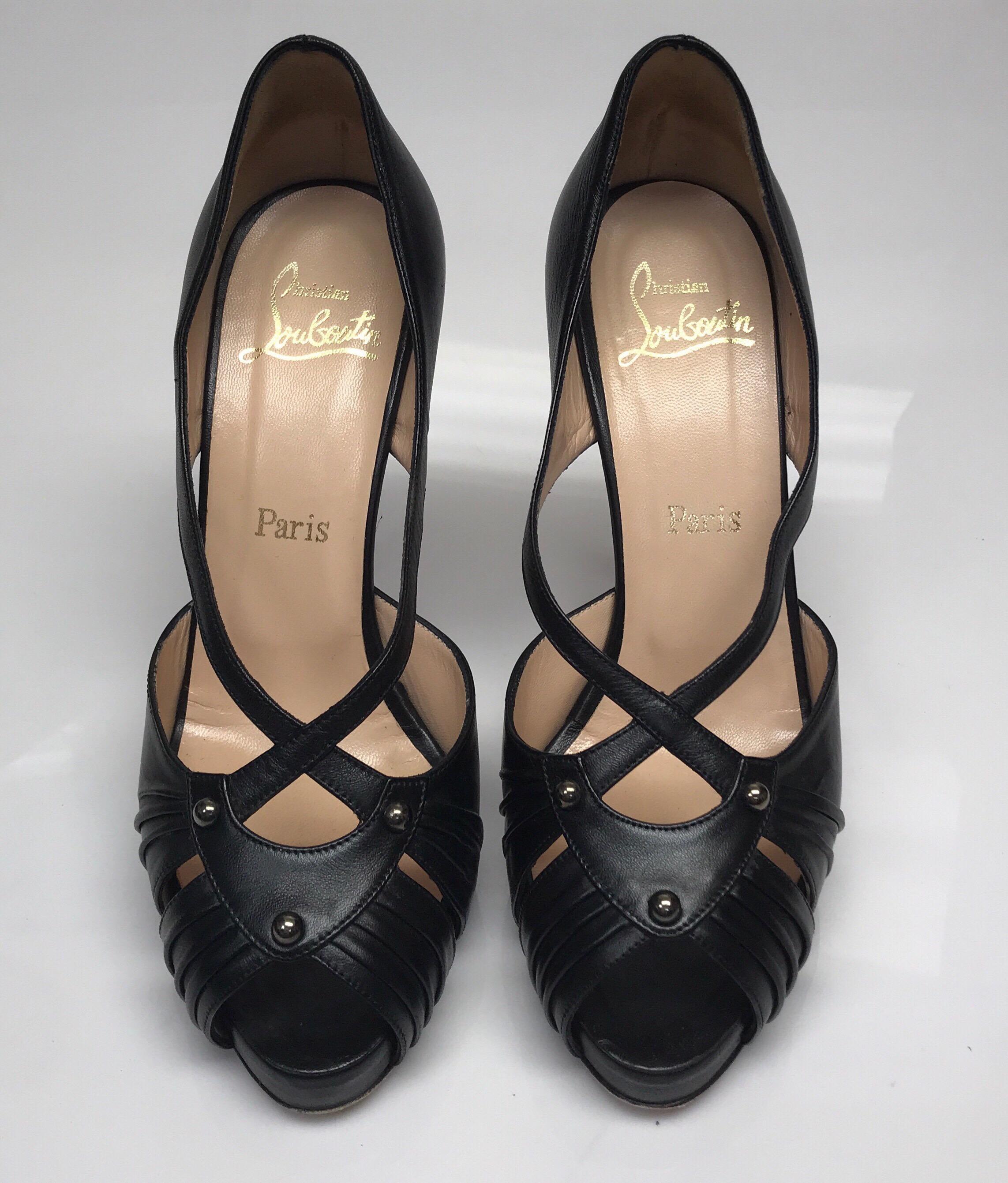 Christian Louboutin Black Strappy Platform Shoes-38.5. These beautiful Christian Louboutin heels are in great condition. They show minor signs of use only to the bottom of the shoe with part of the red rubbed away. They are made of black leather and