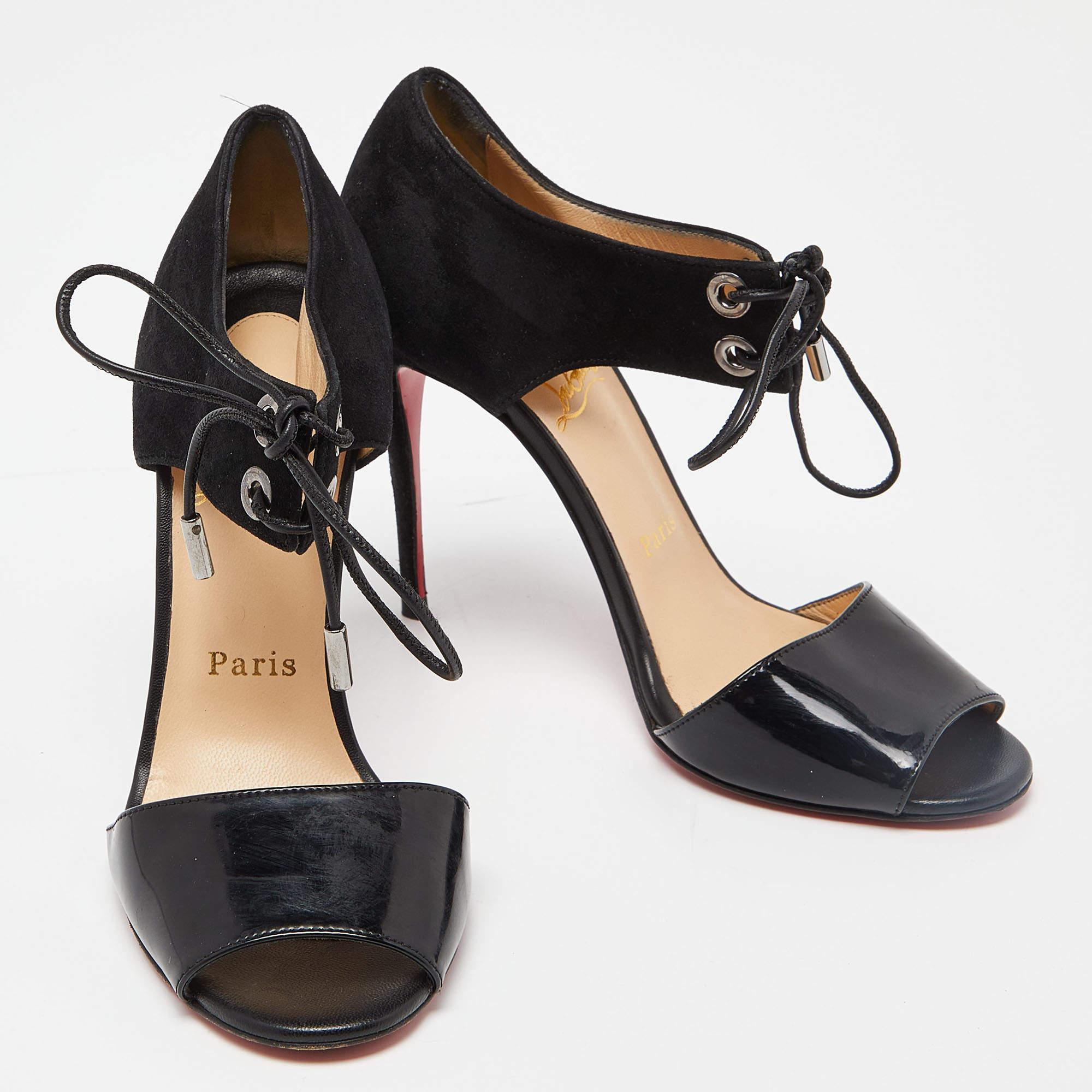 This pair of sandals by Christian Louboutin delivers sophistication. The shoes come made from suede & patent leather in a classy shade of black and are designed with lace-ups and 10cm heels.

