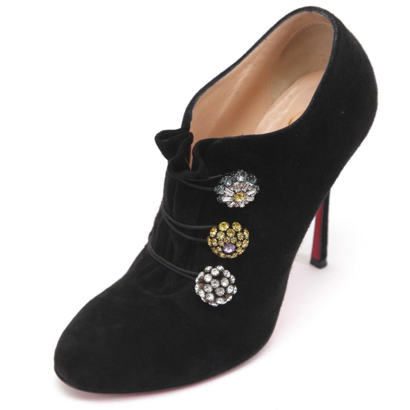 GUARANTEED AUTHENTIC CHRISTIAN LOUBOUTIN BLACK SUEDE BOOTONI MJ 100 ANKLE BOOT

Retail excluding sales taxes approximately $1,245

Details:
- Black suede leather ankle boot.
- 3 crystal adornments over top of foot.
- Almond shaped toe.
- Slip on.
-
