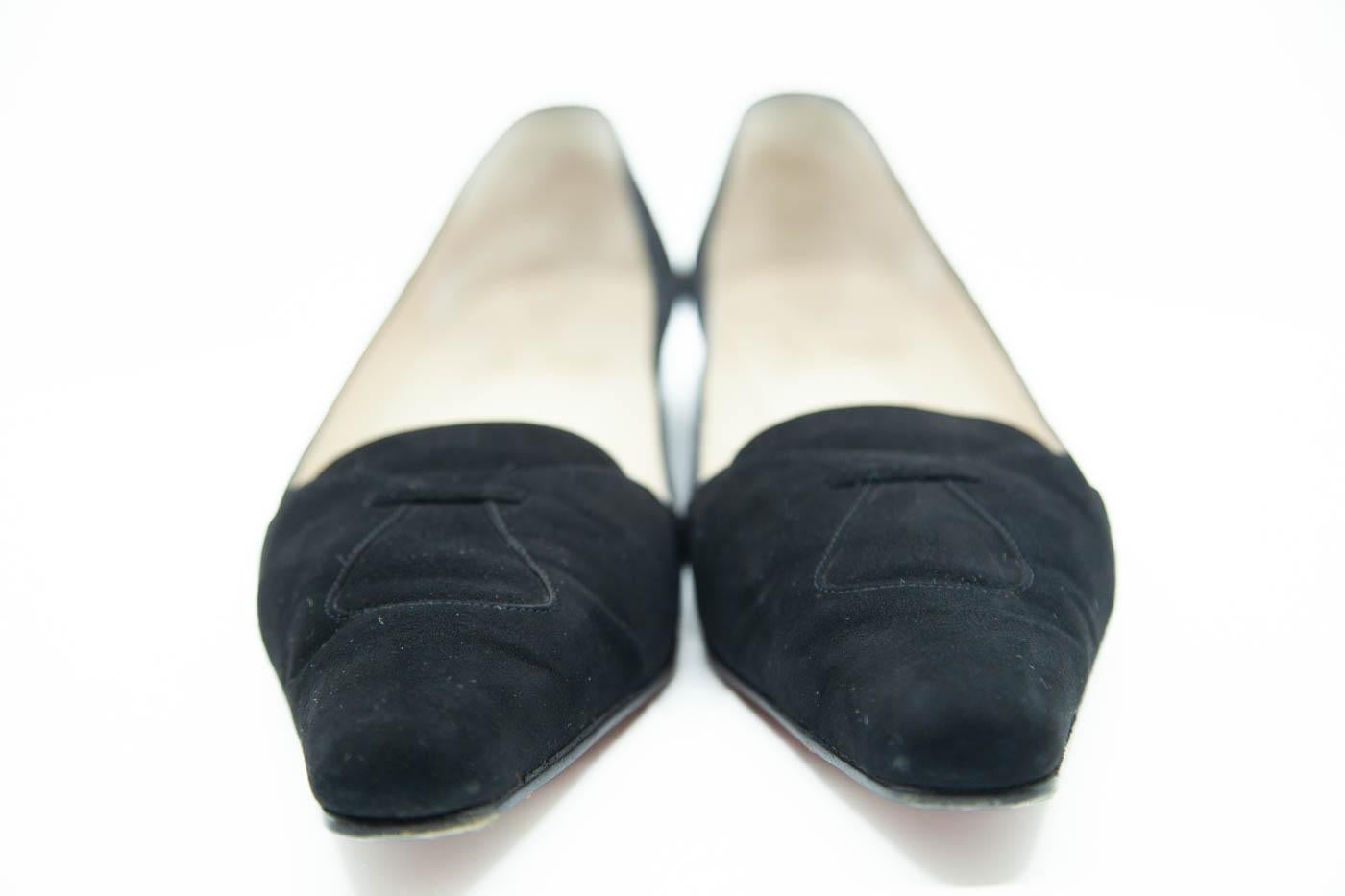  Louis Vuitton black ballerina flat with monogram canvas and include rounded toes, black leather ties with gold tone ends to the vamps and elastic backs, in size 38. Brand marked to insoles and soles.  Original box and dust bag
size 10 1/2