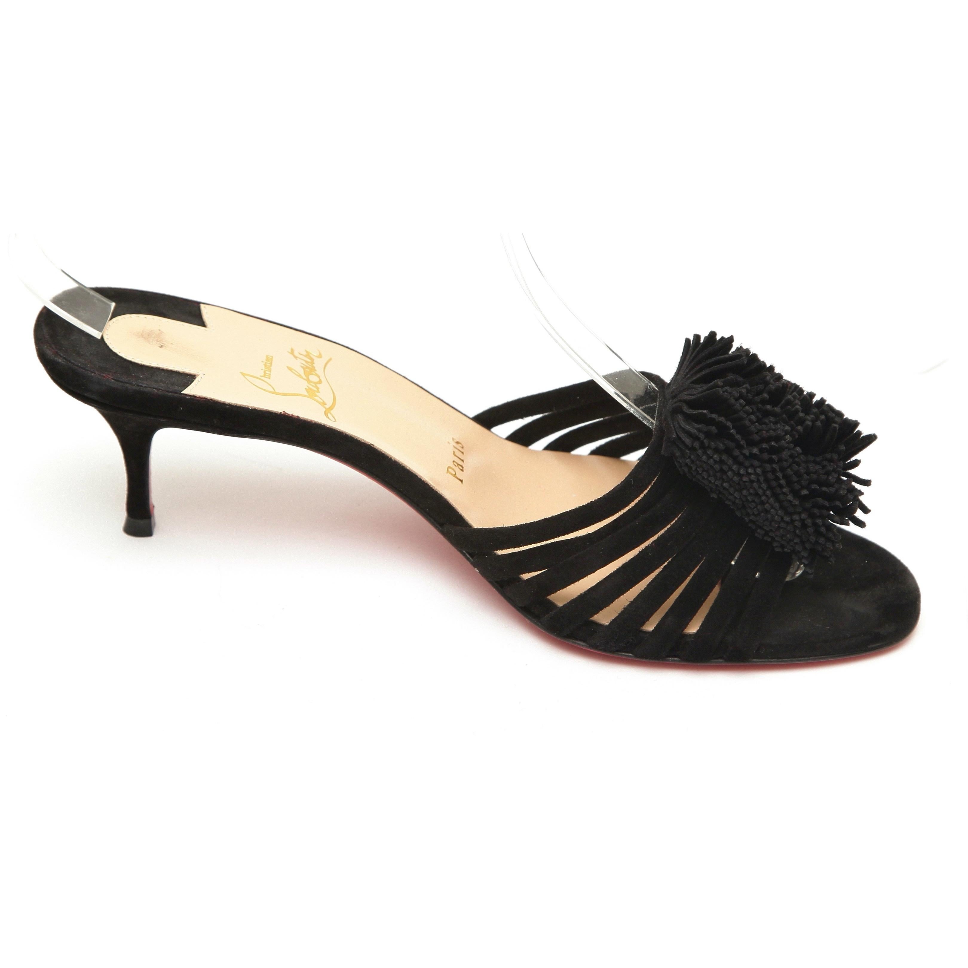GUARANTEED AUTHENTIC CHRISTIAN LOUBOUTIN BLACK SUEDE BELBROSSA 55 SLIDES

Design:
- Thin straps and fringe in black suede over top of foot.
- Slide on.
- Insole leather lining.
- Peep toe.
- Signature red leather sole.
- Comes with Christian