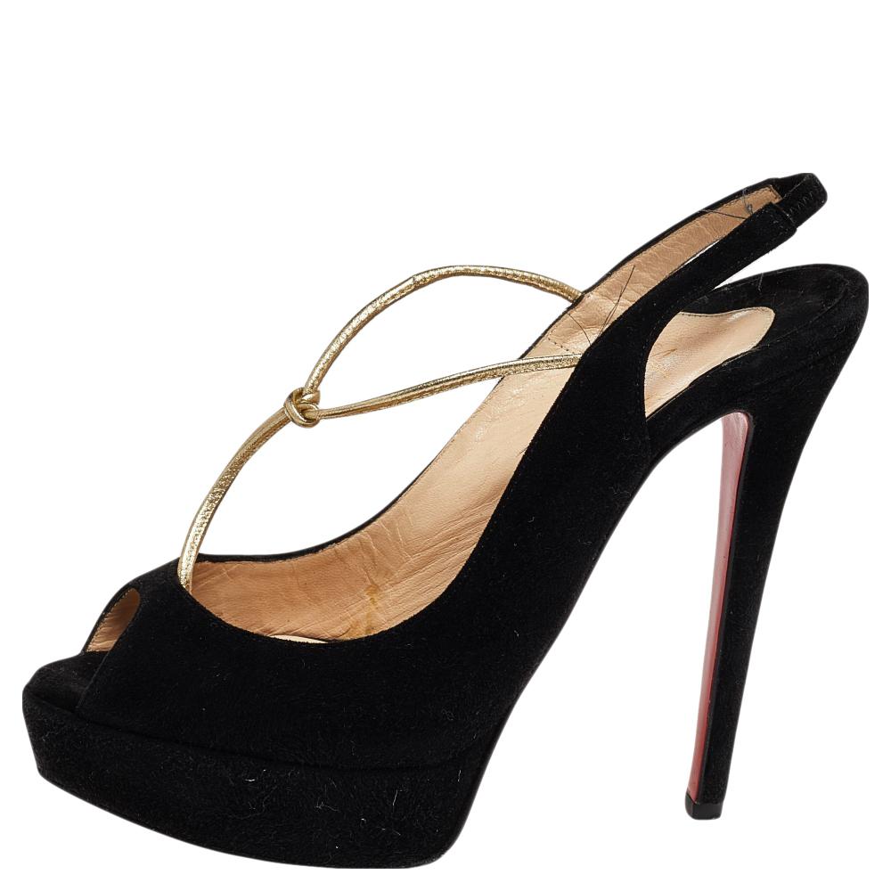 Christian Louboutin's feminine and classy pair of black T-strap sandals are made from smooth suede. The pair features a peep-toe style with slingbacks. The Colibretta sandals have comfortable leather-lined insoles. Pair this up with dresses for a