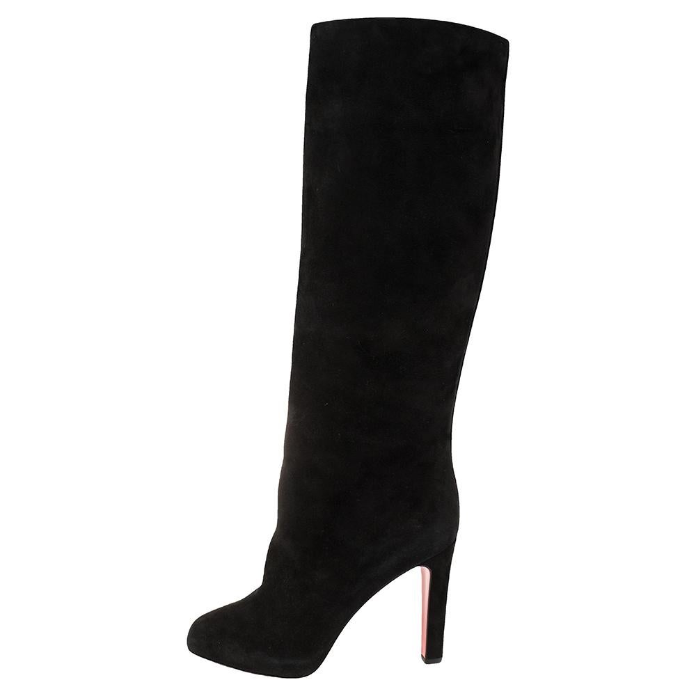 Add an instant chic element to your looks with these stunning Christian Louboutin boots. Constructed in black suede, these almond toe boots are made comfortable with leather-lined insoles. They stand tall on concealed platforms and 11.5 cm heels and