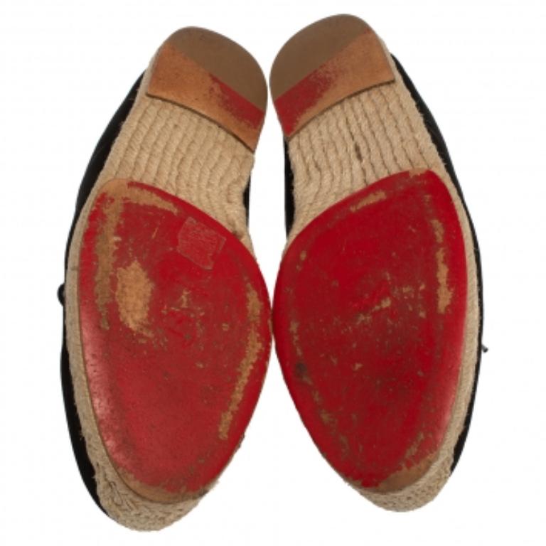 These espadrilles from Christian Louboutin are stylish and trendy enough for you to own them! They have been crafted from black suede and designed with round toes and lace-ups on the vamps. They come equipped with comfortable insoles, braided