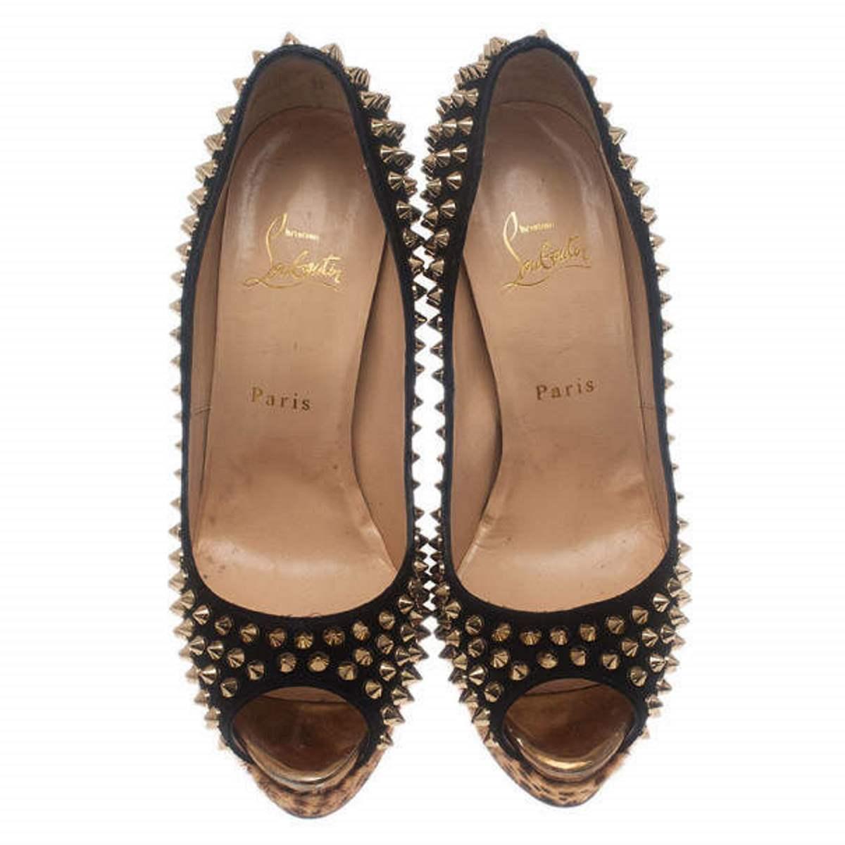 Add these edgy Christian Louboutin Lady Peep Spikes Platform Pumps to make any outfit pop. They are crafted from black suede and covered with silver-tone spikes. They feature leopard pony hair detailing around their bottoms, signature red soles and