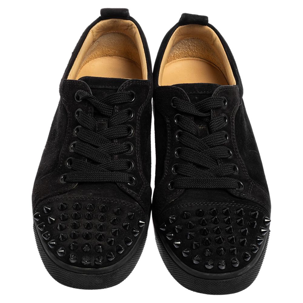 These Christian Louboutin's Louis Junior sneakers are designed in a black suede body and feature trendy spikes detail on the cap toes. Set on a rubber sole, this pair features contrasting lace-ups and comfortable insoles making it easy to slip in