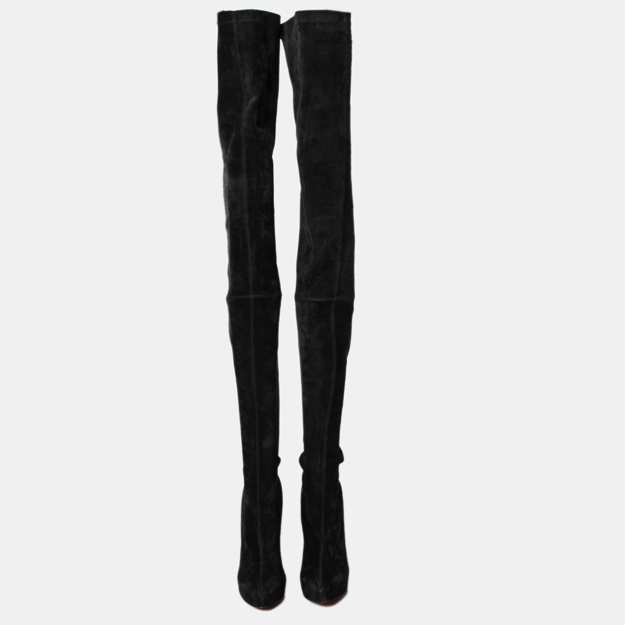 Stun the crowd when you wear these over-the-knee boots by Christian Louboutin. These edgy black boots are made from suede and feature sturdy leather soles, platforms, and towering 15 cm heels. Team them with a mini skirt and a leather jacket or with