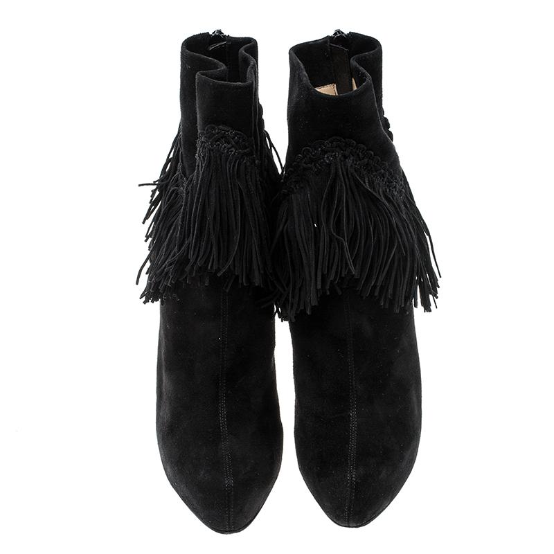 Add an instant touch of glam and fun style to your party looks with these stunning Christian Louboutin Rom platform ankle boots. Constructed in black suede material, these boots are made special with heavy fringe accents all around the ankle which