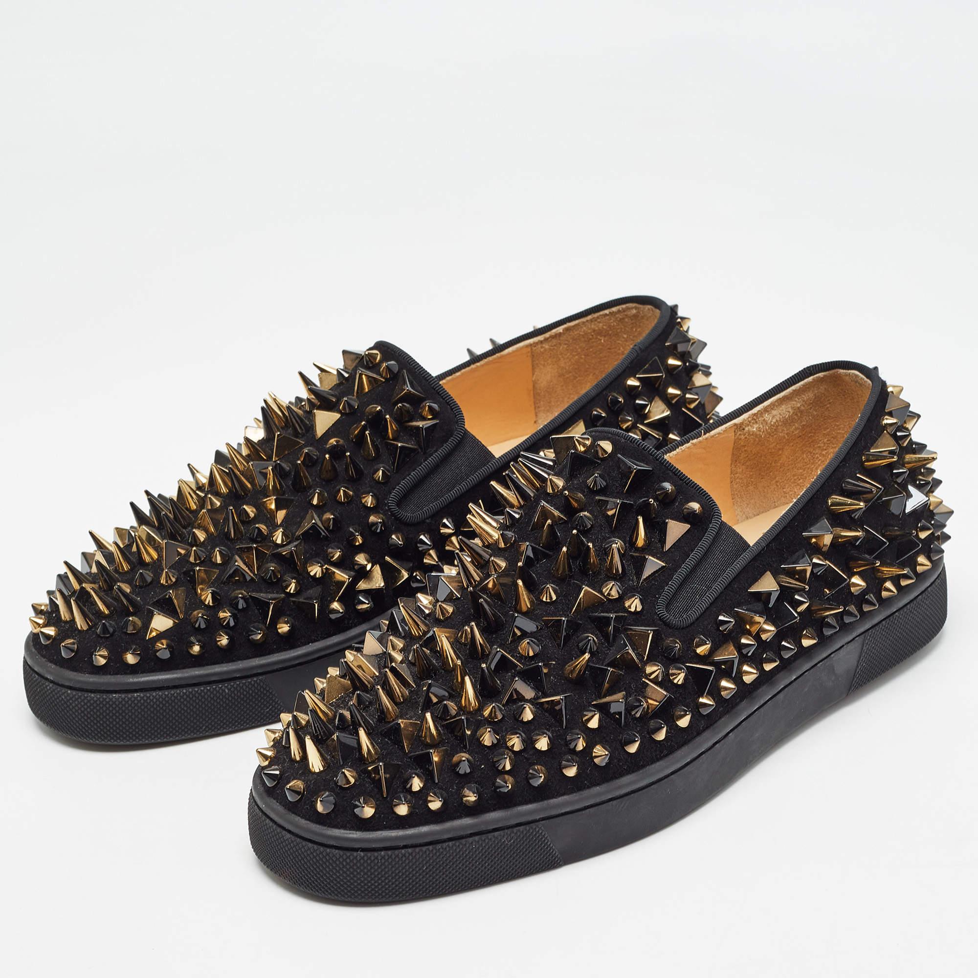 Crafted from black suede these smoking slippers from Christian Louboutin simply stand out They feature a round toe silhouette with the signature spike embellishments adorning the exterior. They are complete with comfortable leather lined insoles and
