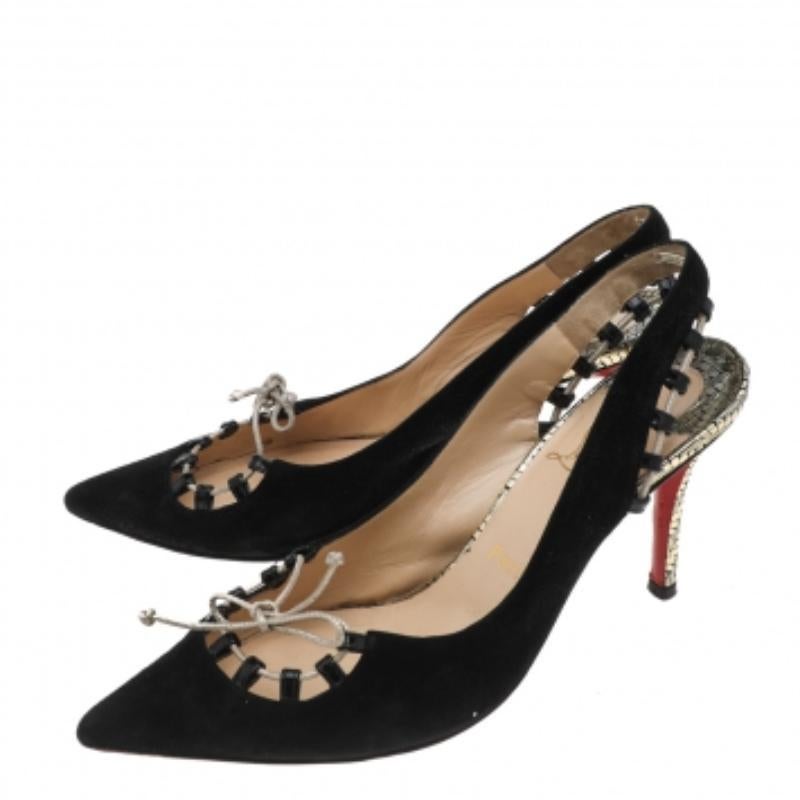 Best acknowledged for his stiletto silhouettes and signature red soles, Christian Louboutin creates fashion-forward designs season after another. Crafted in black suede, these sandals are designed with pointed toes and whipstitches along with the