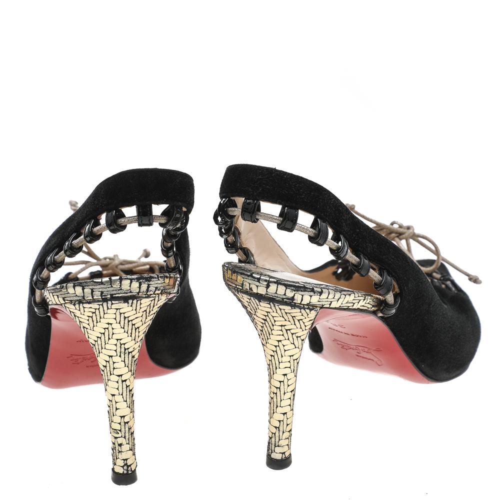 Best acknowledged for his stiletto silhouettes and signature red soles, Christian Louboutin creates fashion-forward designs season after another. Crafted in black suede, these sandals are designed with pointed toes and whipstitches along with the