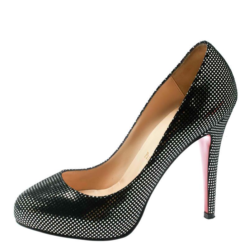 Understated yet glamorous, these Louboutin pumps are sure to add oodles of style to your wardrobe! The black platform pumps have been crafted from suede and styled with almond toes. They feature metallic silver polka dots detailed all over the