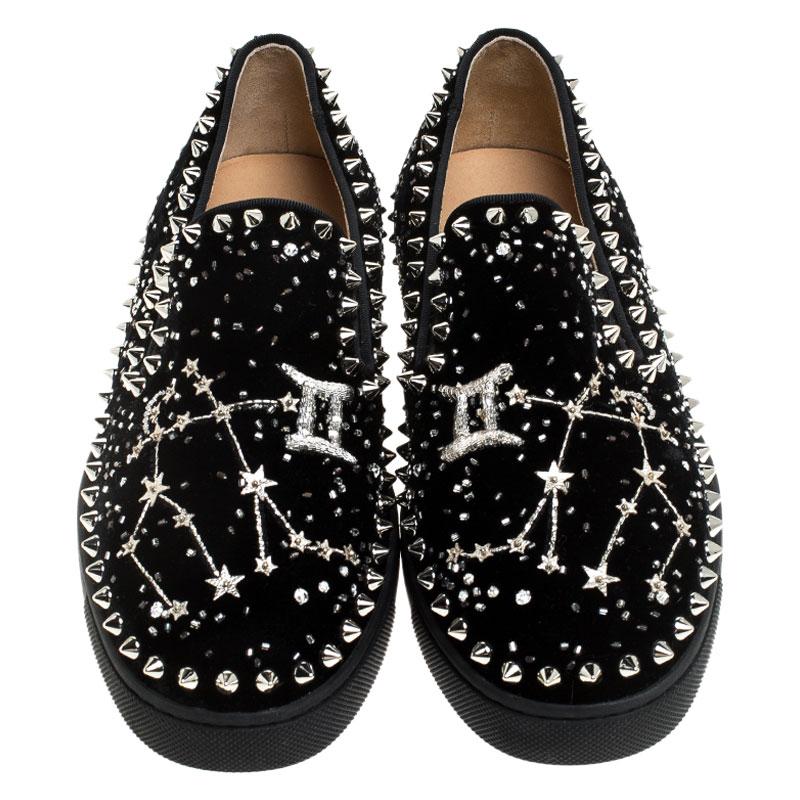 Lightweight and versatile, these exquisite and intriguing sneakers from the house of Christian Louboutin have been meticulously crafted in a black velvet body for a lush look. It comes detailed with stars and crystal embellishments all over and