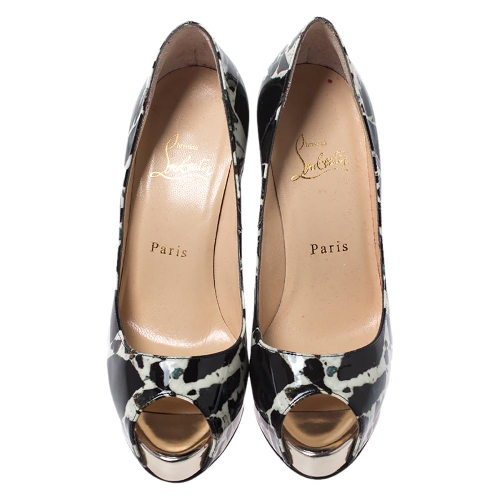Dazzle everyone with these Louboutins by owning them today. Crafted from patent leather, these black-white printed peep-toe pumps carry a mesmerizing shape with 11.5 cm heels. They are lined with leather and come with the signature red soles. This