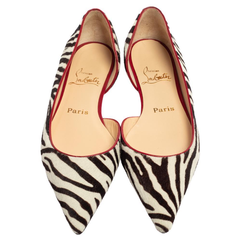 Slide your beautiful feet into these classy Christian Louboutin flats. They have been crafted in calf hair in a d'orsay silhouette and adorned with a bold leopard print and feature pointed toes. They are complete with a snug fit!

Includes: Original