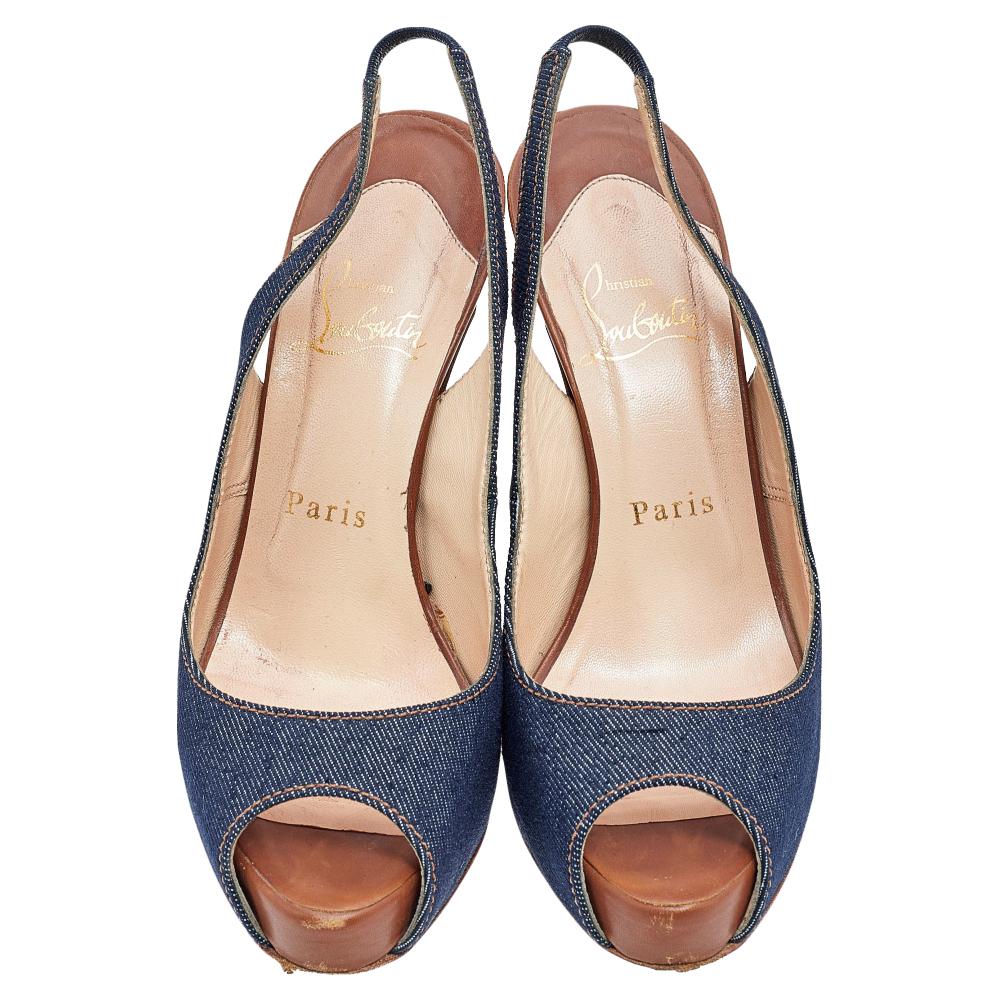 Crafted from denim fabric, this pair is from CL's collection of amazing sandals. The shoes feature peep toes, slingbacks, and 11.5 cm heels supported by platforms.

