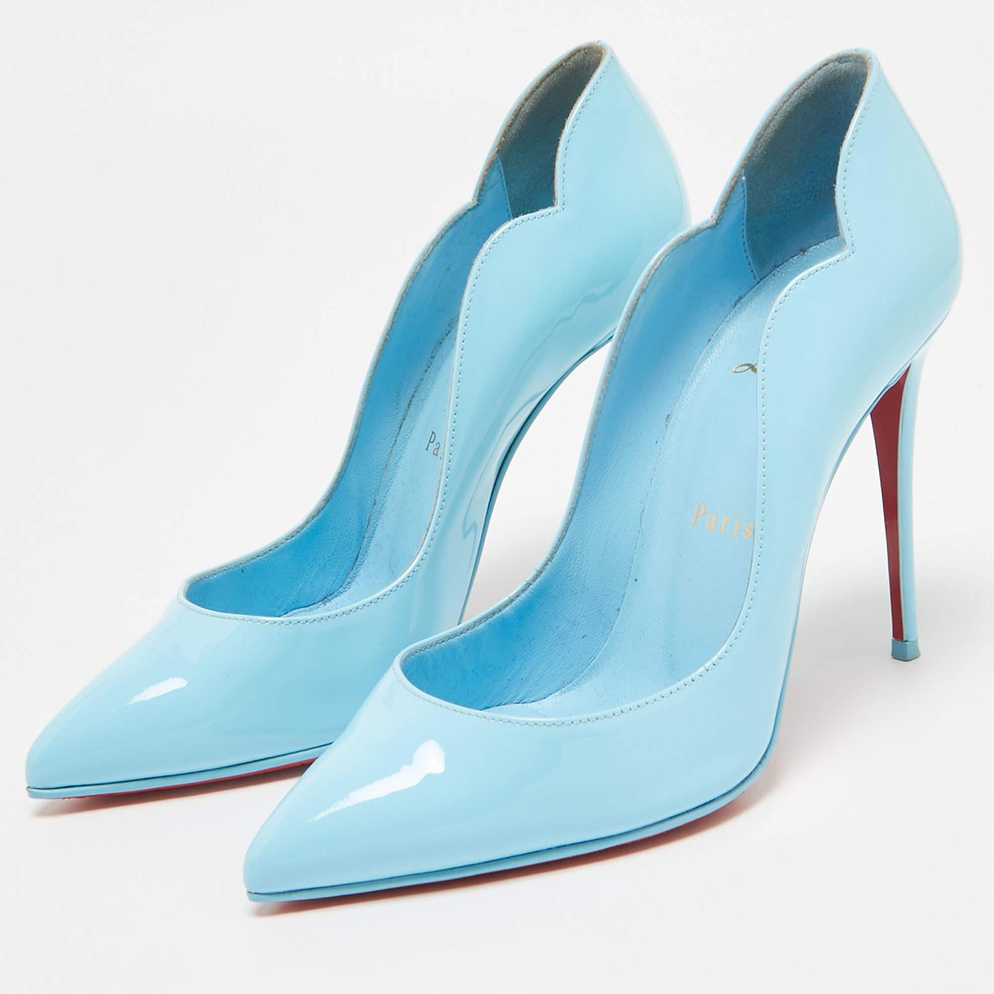 Walk stylishly in these classy Hot Chick pumps from Christian Louboutin. Designed using patent leather on the exterior these pumps display pointed toes slender heels and a slip on style. The red lacquered soles bring an iconic touch. Match these