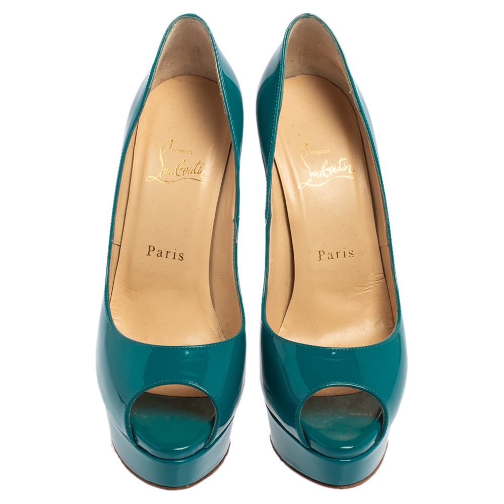 Stand out from a crowd with this gorgeous pair of Louboutins that exude high fashion with class! Crafted from patent leather, this is a creation from their Lady Peep collection. They feature a classic blue shade with peep toes and a glossy exterior.