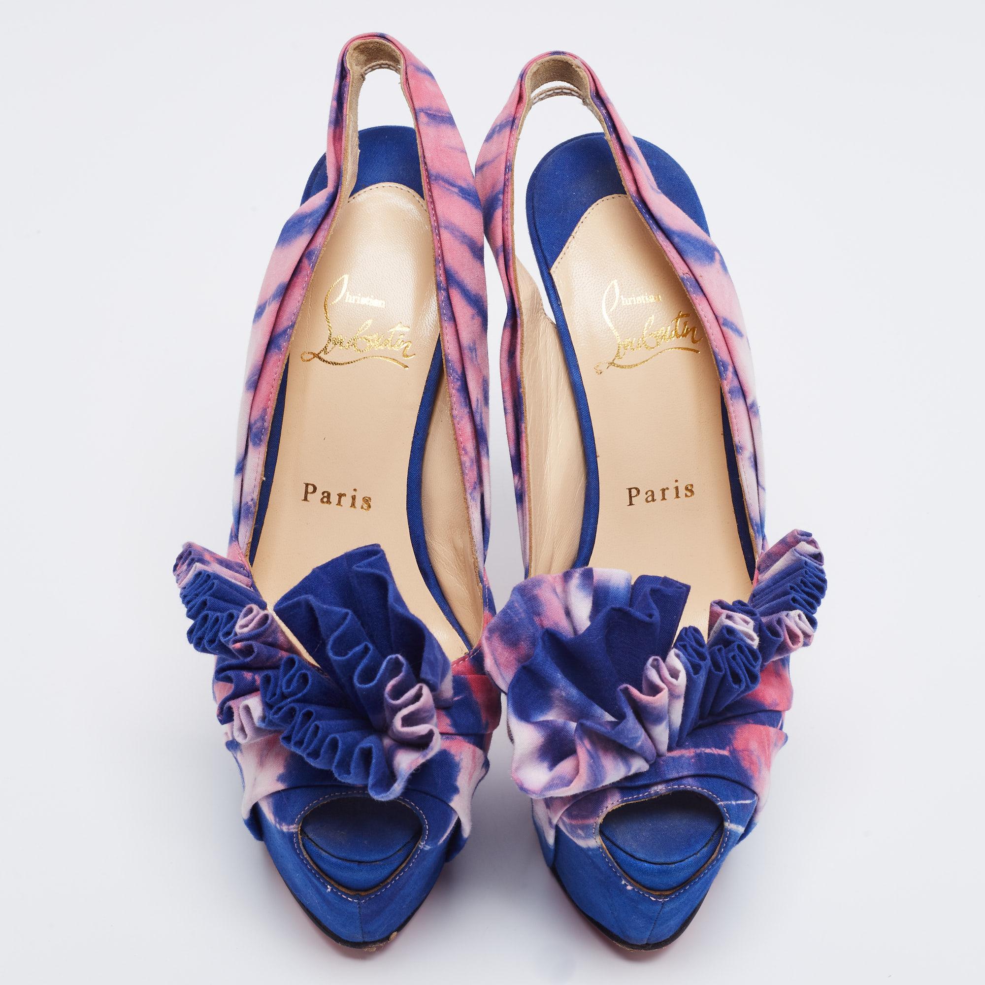 The employment of blue and pink shades lends these Christian Louboutin sandals an elegant contrast. Created from fabric, the design is highlighted with attractive detailing on the vamps and features 15.5cm heels for the perfect height.

