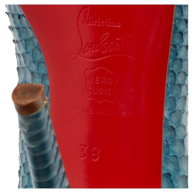 This pair of Very Prive pumps by Christian Louboutin is a timeless classic. Step out in style while flaunting these python leather pumps in blue, ideal for special occasions. They feature peep toes, platforms, and 11.5 cm heels. The textured pumps