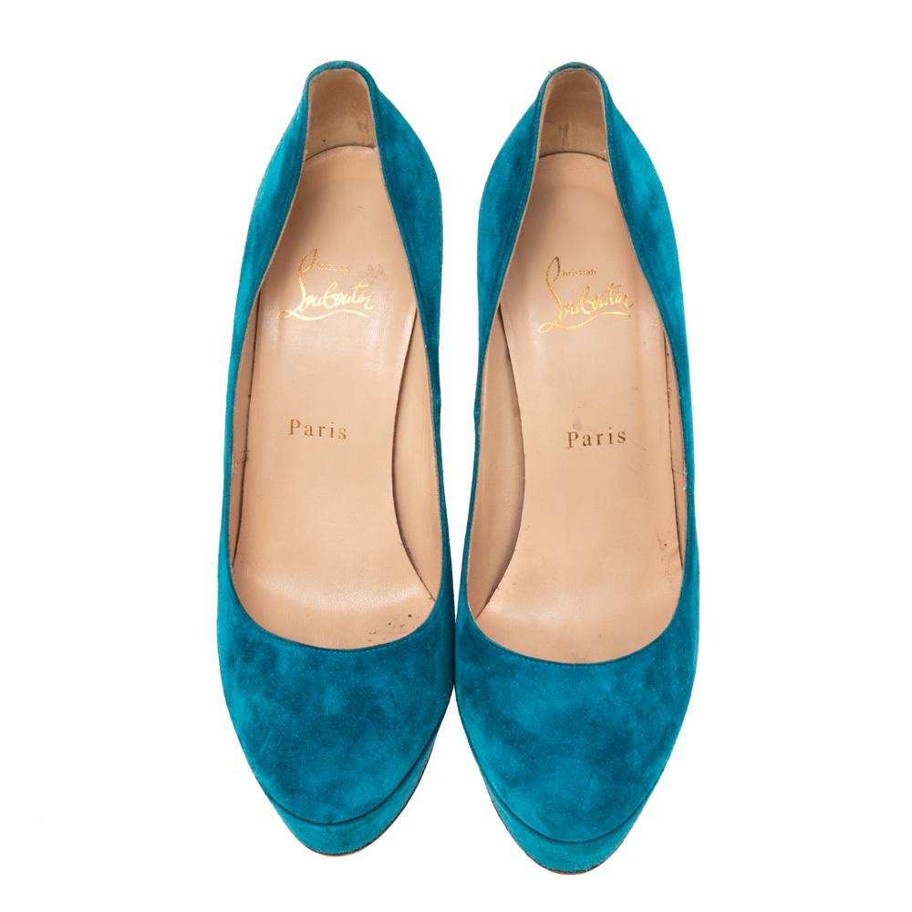 Every shoe collection needs a pair of ageless pumps as enchanting as this one from Christian Louboutin. Made from suede in a blue hue, these pumps flaunt almond toes forming a sleek arch that ends on 14 cm stiletto heels and supported by platforms.