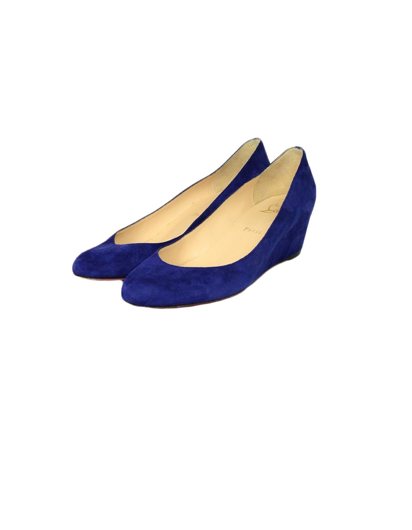 Christian Louboutin Blue Suede Covered Wedges sz 41

Made In: Italy
Color: Blue 
Materials: Suede
Closure/Opening: Slip on
Overall Condition: Very good pre-owned condition, with the exception of wear on the soles

Marked Size: 41
Heel Height: