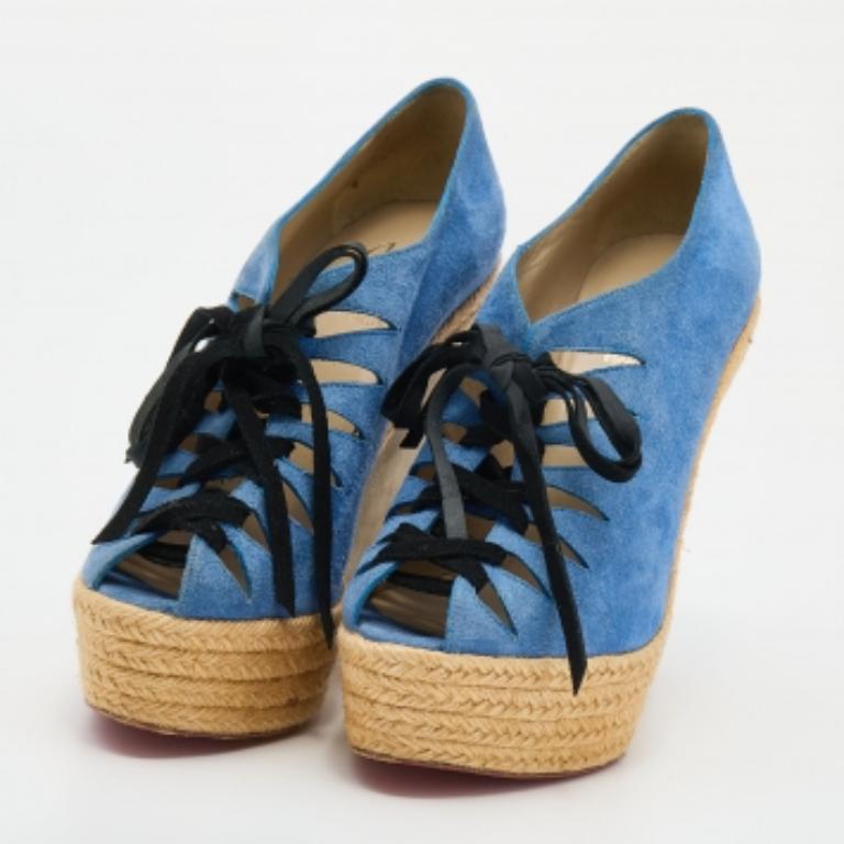These Christian Louboutin sandals are perfect for summer! They are crafted from suede and feature lace-ups, platforms, and espadrille wedge heels. They are complete with smooth leather insoles and sturdy soles to provide a comfortable fit.