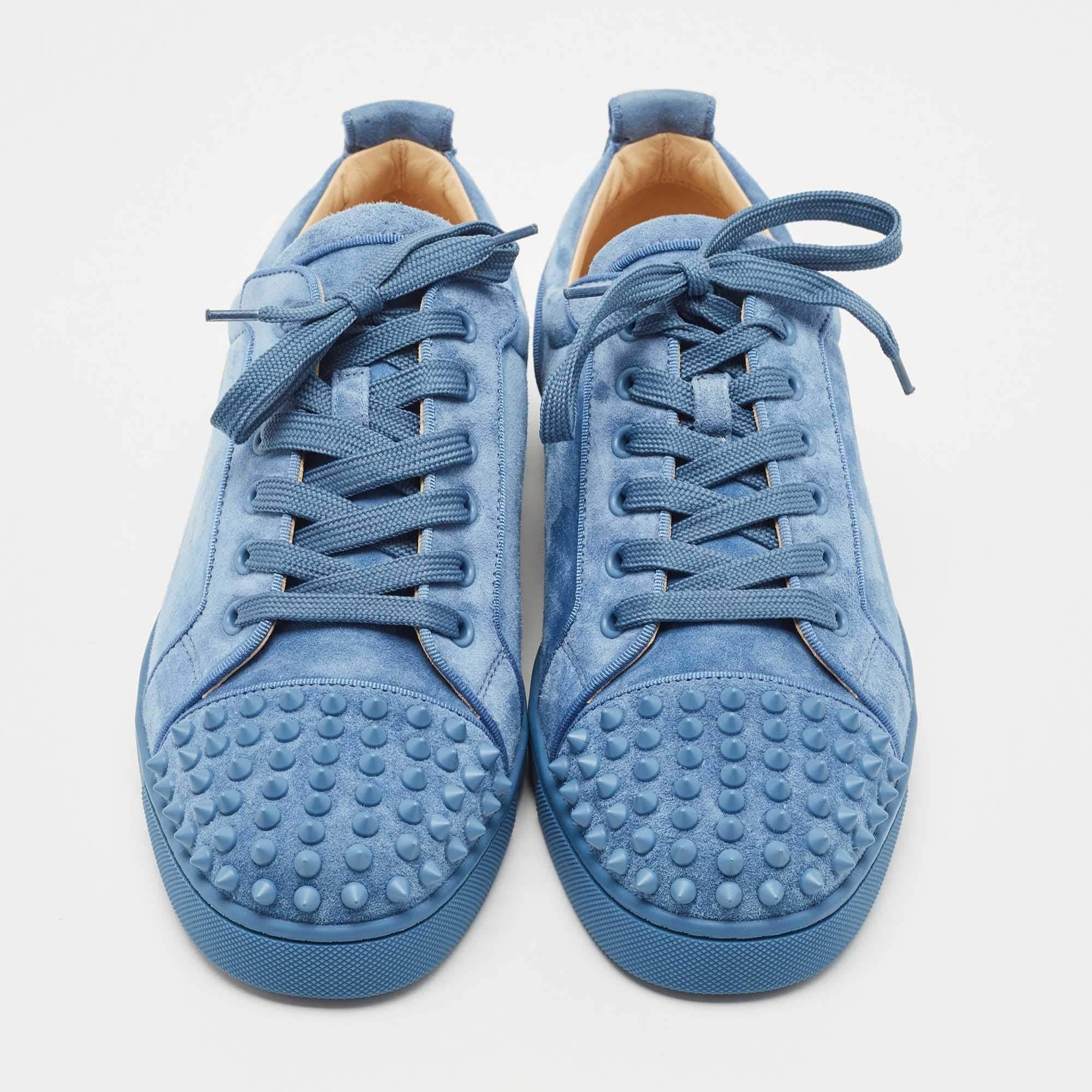 Designed with spikes and crystal embellishments, these Christian Louboutin sneakers are the ultimate favorite of the fashion elite. They've been crafted from suede in a blue shade with a pull tab on the counters. The comfortable sneakers are easy to