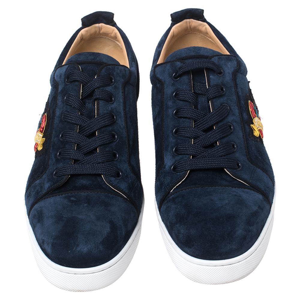 A pair of suede sneakers to lend one all the comfort that good footwear can offer. These designer men's sneakers will give you ease in every step. Designed by Christian Louboutin, they come in blue with lace-up closure on the vamps and durable