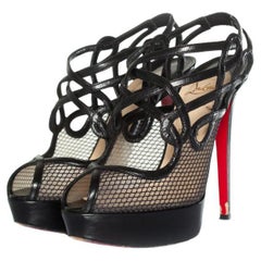 Christian Louboutin, Branda slingback fishnet heels.