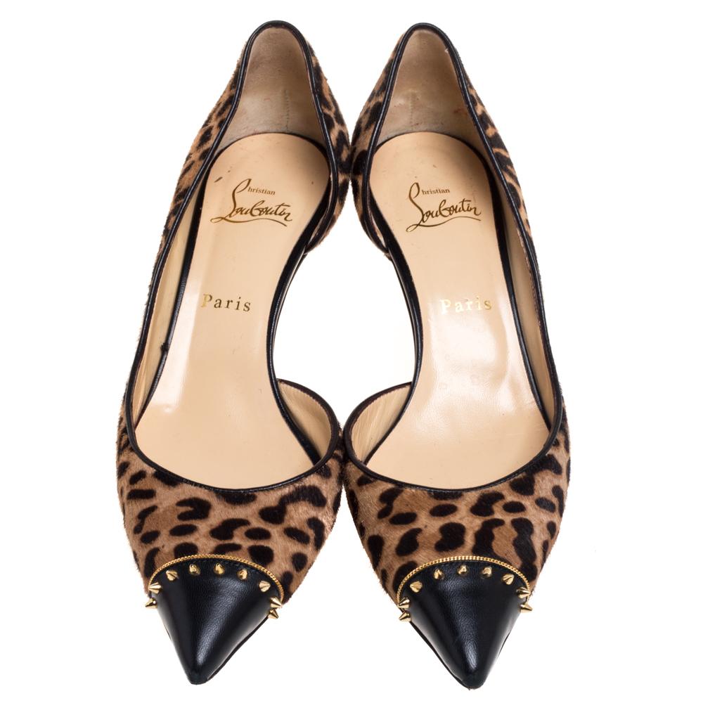 These Culturella D'orsay pumps from Christian Louboutin are sure to add oodles of style to your closet! The leopard-printed pumps are crafted from calfhair and feature leather pointed toes accented with spikes. They come equipped with comfortable