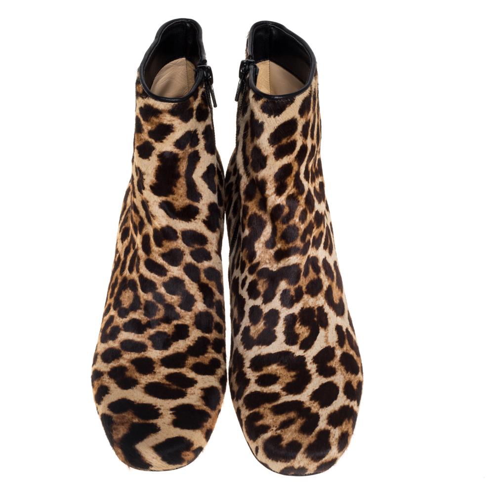 Christian Louboutin impresses us with these fabulous Tounoir ankle boots that come crafted from brown and beige leopard printed calf hair in a round toe silhouette. They are styled with side zippers and low block heels and endowed with comfortable