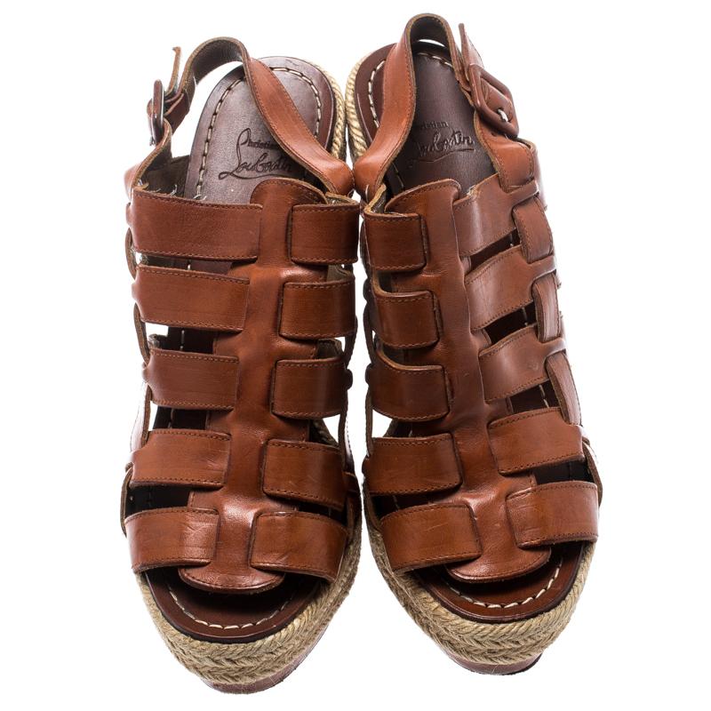 Look your casual best as you step out in these leather sandals. The uber comfortable leather sole is designed to offer the best comfort and fit. These sandals from Christian Louboutin are one of a kind in trendy women's footwear. These brown sandals