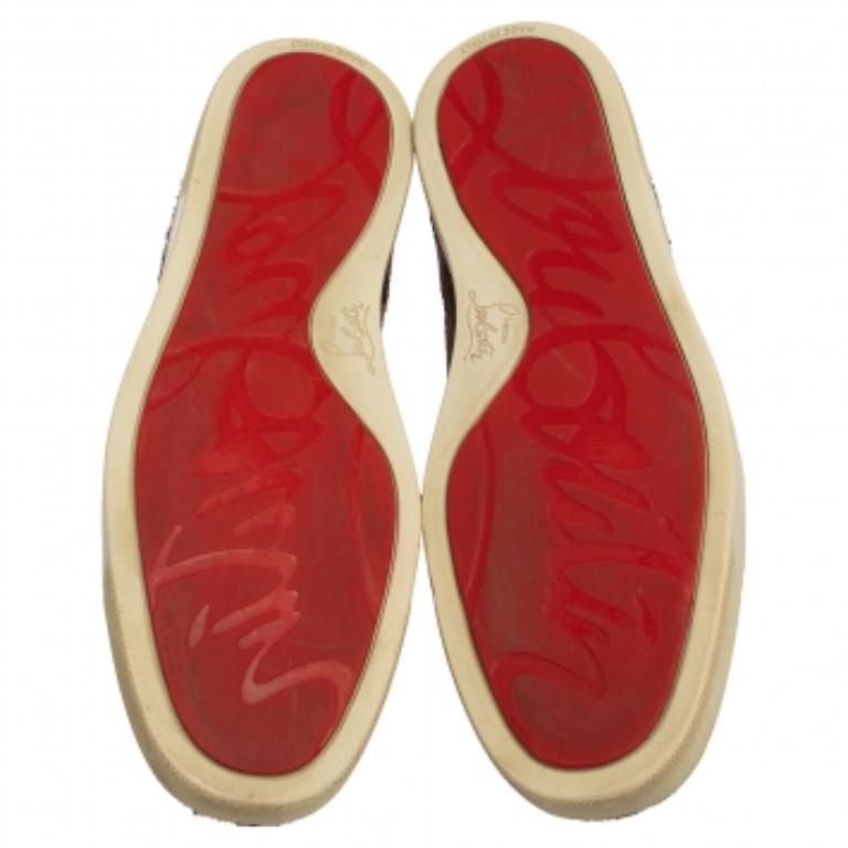 Pull off a stylish look with class in this pair of stylish sneakers from Christian Louboutin. Crafted from leopard-printed calf hair, this pair truly embodies luxury and comfort. The brown-hued sneakers feature lace-ups, leather insoles, and red
