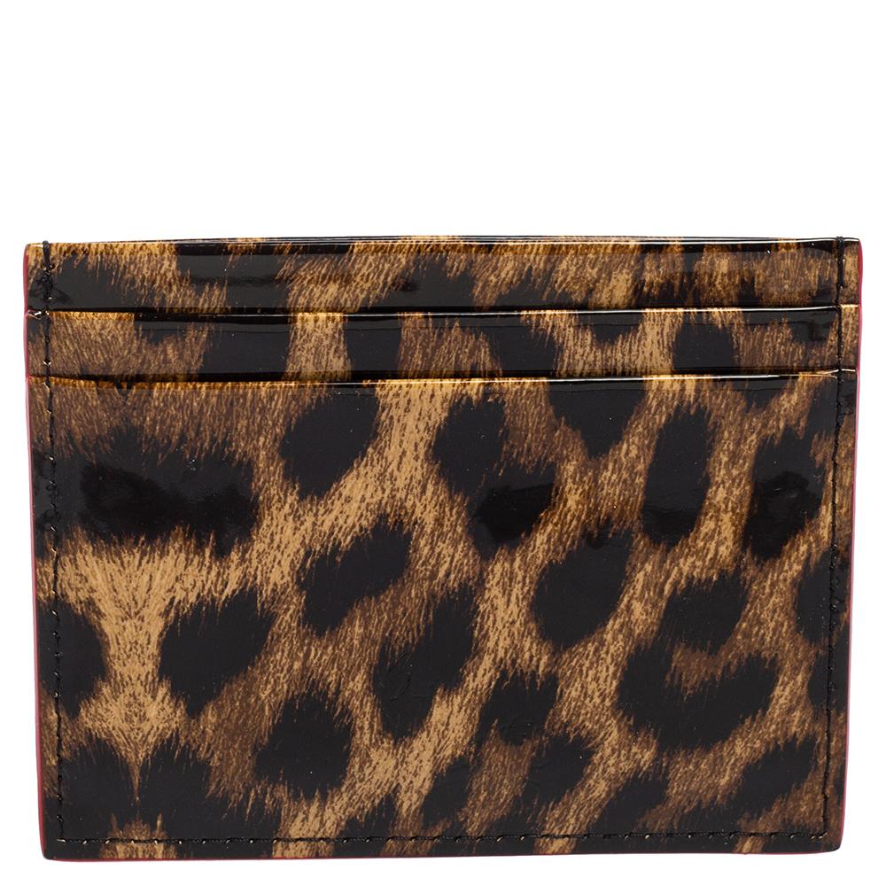 This cardholder from Christian Louboutin brings an amazing blend of style and functionality. Crafted using leopard-printed patent leather, it is beautifully adorned with spike studs on the front. It comes with enough slots to hold the cards you need