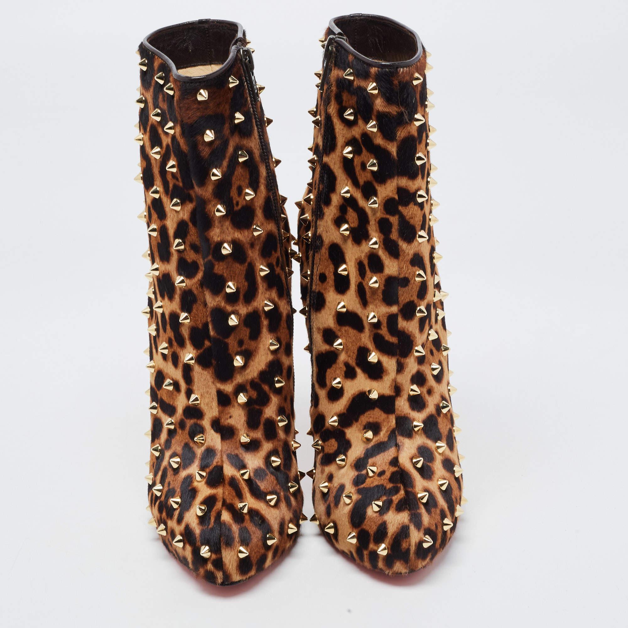 Enjoy the most fashionable days with these stylish ankle boots from Christian Louboutin. Modern in design and craftsmanship, they are fashioned in leopard-printed pony hair and designed with side zippers, concealed platforms, 9cm high heels, and
