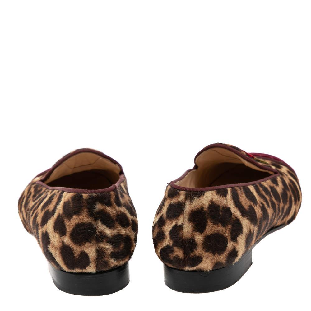 Indulge in CL's aesthetic of luxurious fashion with this pair of smoking slippers. Sewn using velvet and leopard-printed pony hair, the slippers bring round toes, lined insoles, and a comfortable fit.

