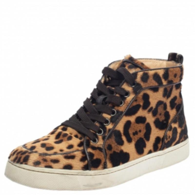 Pull off a stylish look with ease in this pair of high-top Rantus Orlato sneakers from Christian Louboutin. Crafted from leopard-printed pony hair, this pair embodies statement appeal and comfort. The CL sneakers feature lace-ups, leather insoles,