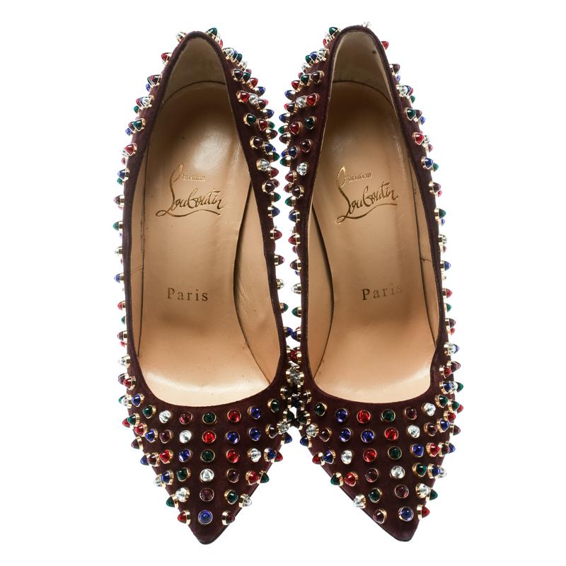 Grab these edgy, chic Christian Louboutin Pigalle pumps. They will definitely bring out the rocker girl in you, and make you walk with confidence. They feature a brown suede exterior with an abundance of multicolored studs all around. They also have