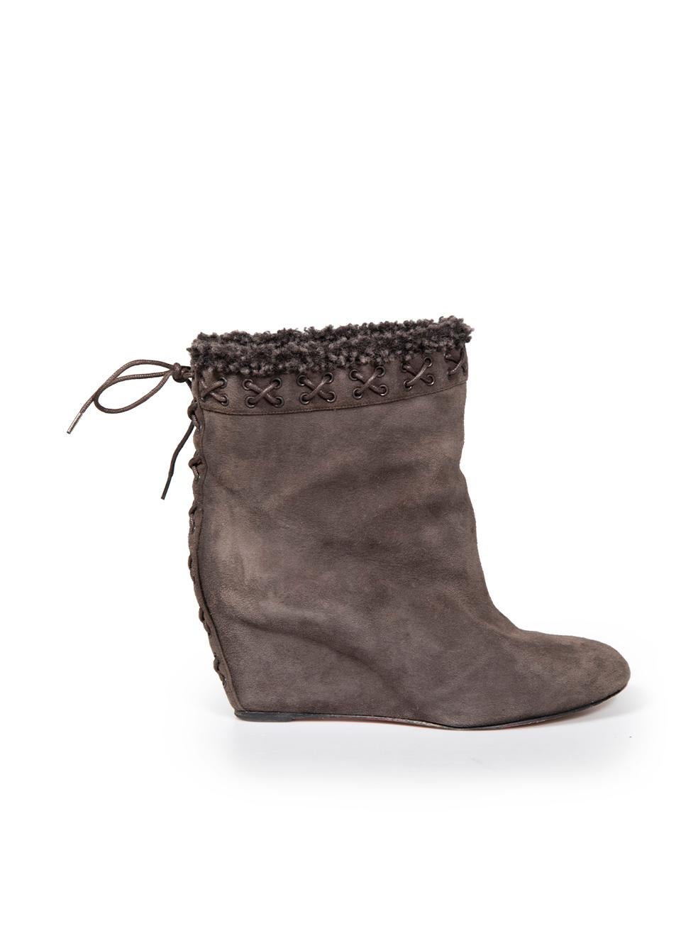 CONDITION is Good. Minor wear to boots is evident. Wear to soles and light abrasion to back suede heel edge on this used Christian Louboutin designer resale item.
 

 

 

 Details
 

 

 Brown
 

 Suede
 

 Ankle boots
 

 Wedge mid heel
 

 Almond