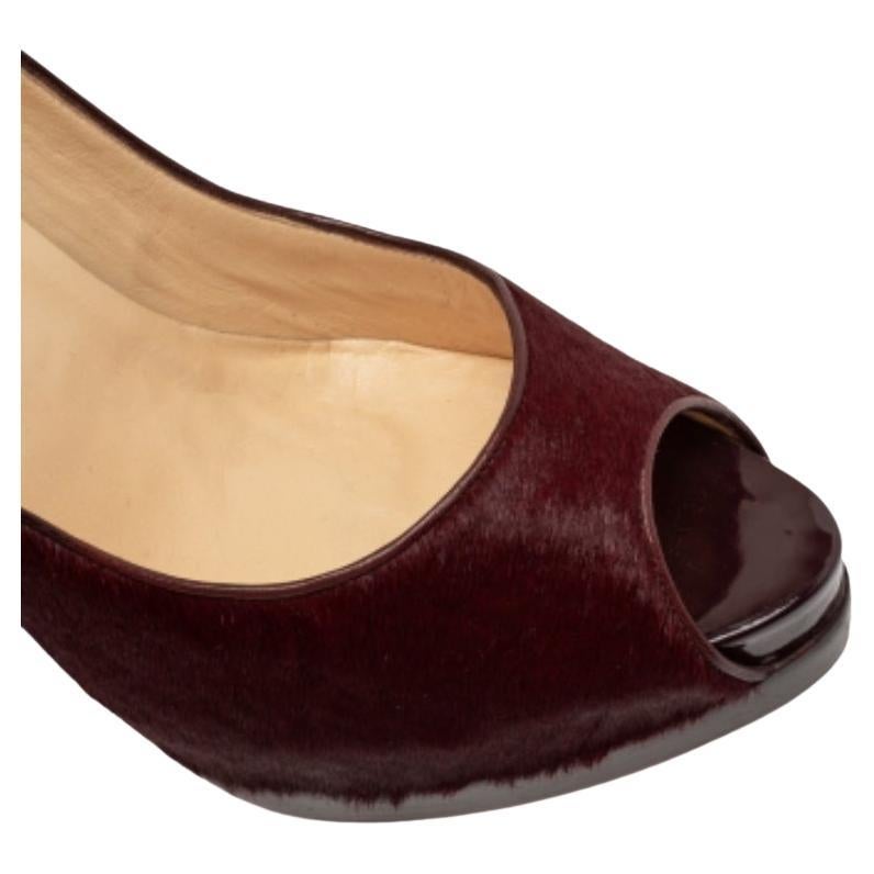 These Christian Louboutin pumps are a great choice if you’re looking to add a pair that's both classy and versatile. The pair has a peep-toe silhouette with burgundy calf hair forming the exterior and 14 cm heels giving the design a classy finish.
